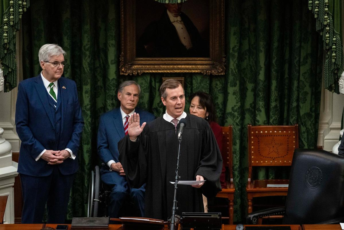 Lt. Gov. Dan Patrick and Gov. Greg Abbott look on as Chief Justice of the Supreme Court of Texas Jimmy Blacklock swears in state senators during the opening of the Texas Senate in Austin on Tuesday, Jan. 14, 2025.