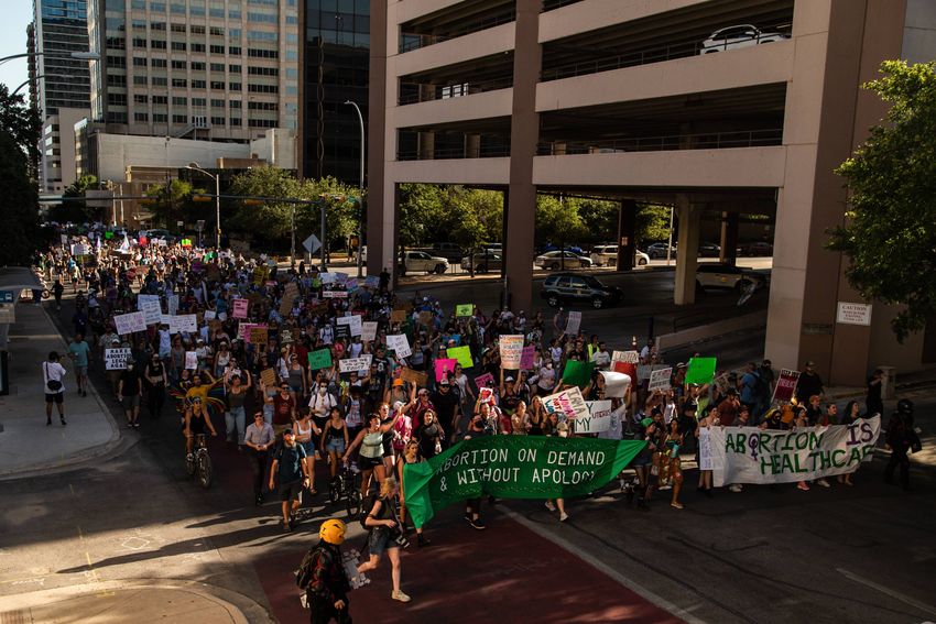 Protesters marched from the federal courthouse to the state Capitol in opposition of the Supreme Court's decision to overtur…