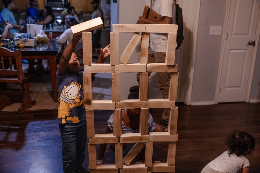 The Avila grandchildren make a Jenga version of the detention facility where their grandmother, Margarita, has been for over three months Saturday, May 24, 2025, in Houston.
(Lexi Parra for The Texas Tribune)