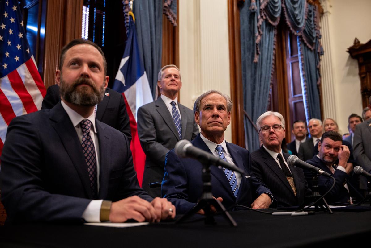 House Speaker Dustin Burrows, Gov. Greg Abbott and Lt. Gov. Dan Patrick at a bill signing ceremony at the Capitol in Austin on April 23, 2025.