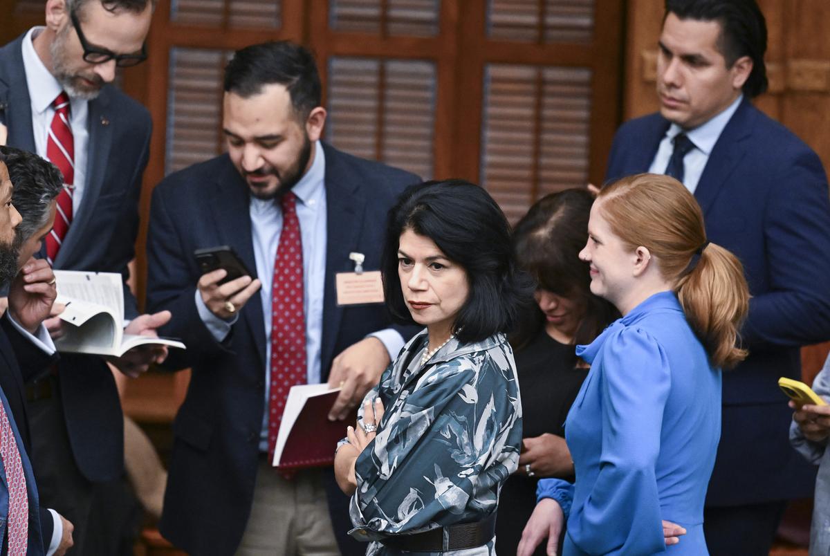 Sen. Carol Alvarado, D-Houston, with her staff on the Senate floor, moment before the final vote on HB 4 on August 22, 2025.
