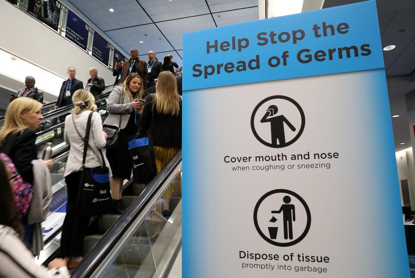 Visitors pass a sign warning about the spread of germs, after another case of the COVID-19 was confirmed in Toronto, Canada. March 1, 2020.