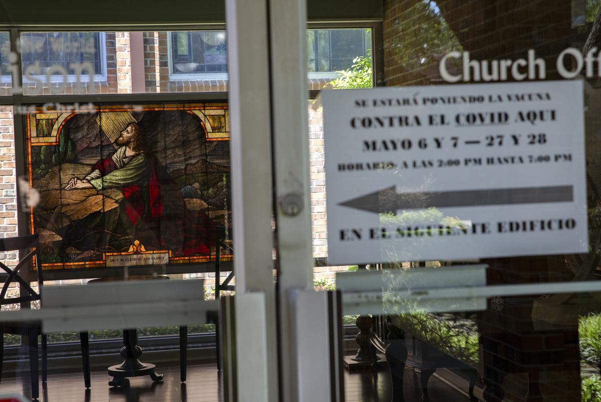 Signs guide patients at the Tennison Memorial United Methodist Church towards the activity center, where the Texas Department of State Health Services hosted a vaccine clinic in Mt. Pleasant on May 7, 2021.