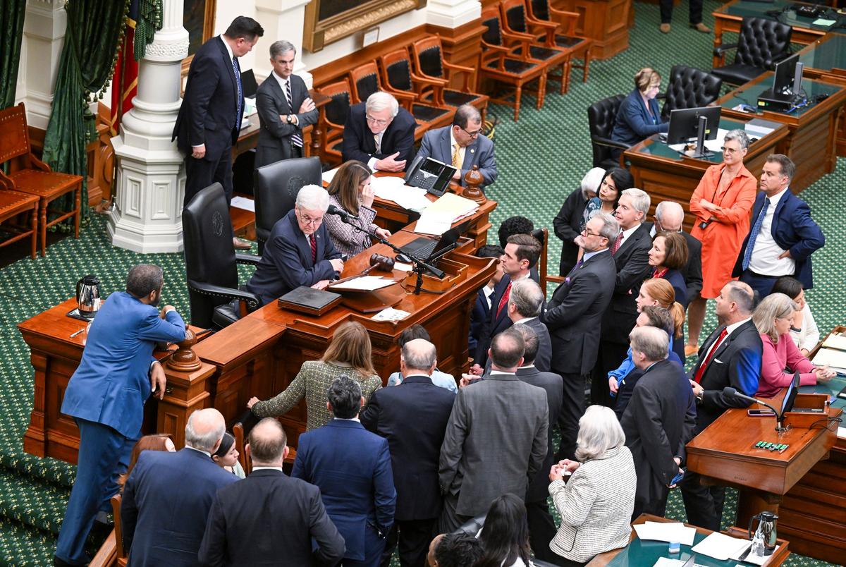 Lt. Gov. Dan Patrick gathers the senators at his desk before the final vote on the mid-decade redistricting bill in the Texas Senate on Aug. 22, 2025.