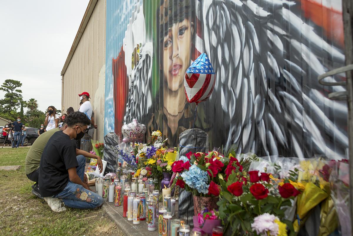 Juan Cruz kneels in front of a mural honoring his girlfriend, Army Specialist Vanessa Guillén, on Sunday, July 5, 2020.