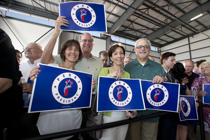 Supporters of Rick Perry get revved up before the former Texas governor announced his 2016 plans Thursday at the Addison Airport.