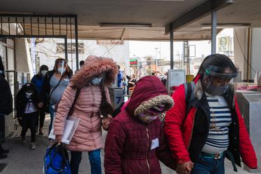 Migrants in MPP cross the Paso del Norte International Bridge from Ciudad Juárez to El Paso on Feb. 26, 2021.