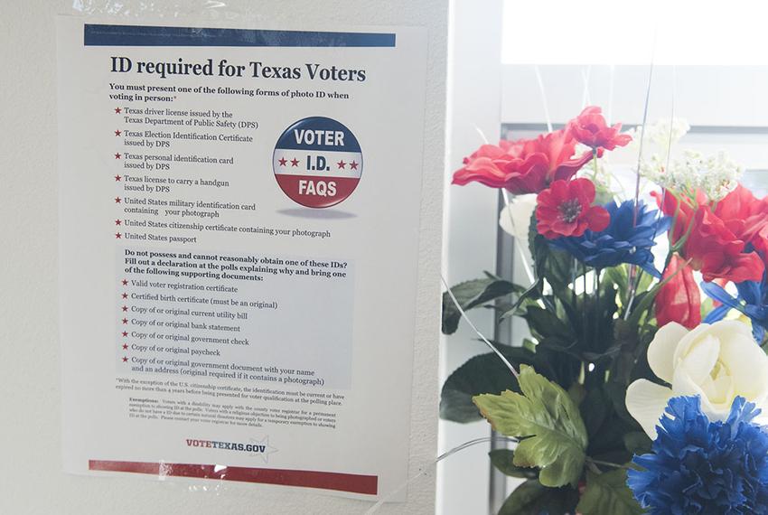 Voter ID regulations posted at a south Texas early voting location on Oct. 26, 2016.