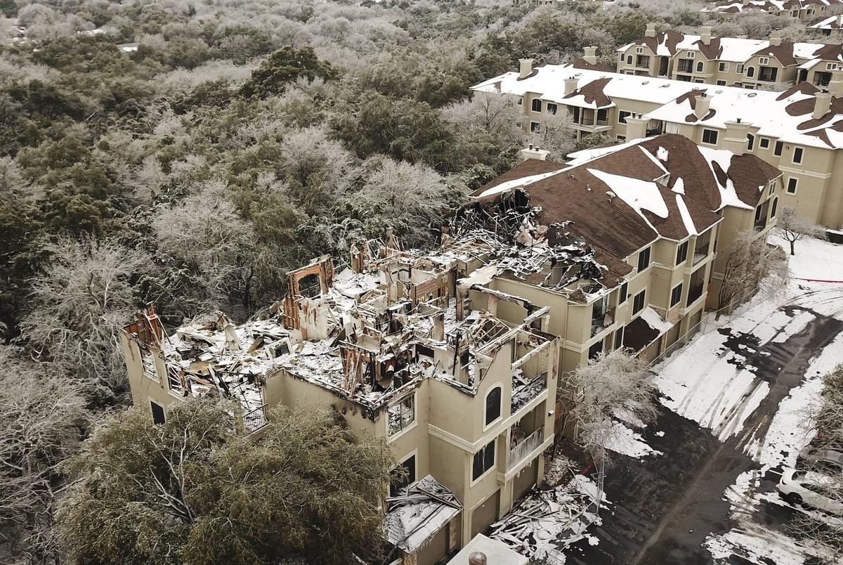 Aerial view of fire damage at an apartment building at The Park on Brodie Lane. Feb. 18, 2021.