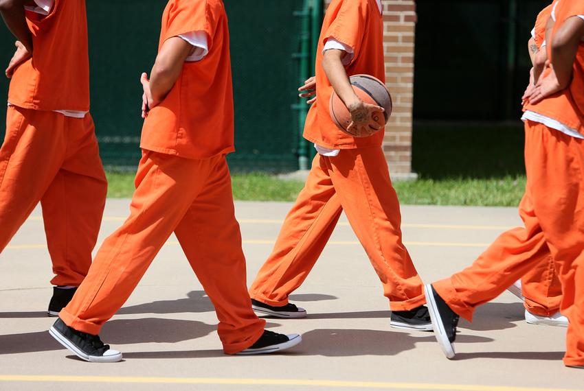 Detainees line up to leave the outdoor recreation area at the Travis County Juvenile Detention Center in Austin on June 24, 2013.