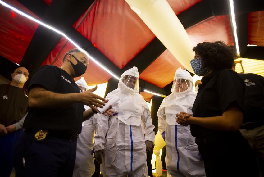 Dr. Umair Shah speaks with Harris County Judge Lina Hidalgo during a media tour of a medical shelter at NRG Park in Houston on Saturday, April 11, 2020. The facility was built in less than a week for possible overflow of COVID-19 patients in the greater Houston area.