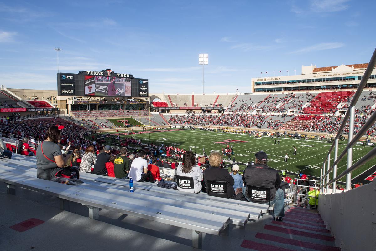 Fans watched Texas Tech's home coming game against West Virginia at Texas Tech University on Saturday in Lubbock, Texas. Texas Tech Athletics has reduced attendance to 25% of the general seating capacity of Jones AT&T Stadium.