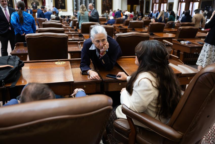 Rep. Lulu Flores, D-Austin, speaks with representatives Joe Moody, D-El Paso, and Rep. Mary E. González, D-Clint, on the floor of the Texas House on Aug. 18, 2025.
