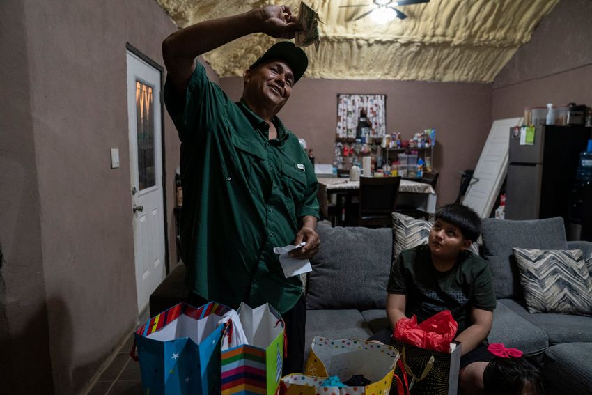 Jaime Galván-Sánchez shows the money that he got as a present during his birthday party celebration at his home in Mercedes, Texas on March 8, 2025. 
Gabriel V. Cárdenas for The Texas Tribune