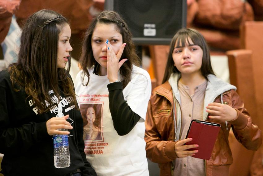 Twins, Nitza Alvarado Espinoza (black shirt) and Mitzi Alvarado Espinoza, with their sister Deisy, at a rally in Austin on November 9. The sisters started "Hijos de Desaparecidos" after their mom was kidnapped by the Mexican military in Chihuahua. They are currently in deportation proceedings but their attorney has filed a petition seeking a special-immigrant status since they were abandoned or orphaned.