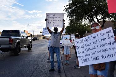 Protesters stand in traffic as they demonstrate outside of the Odessa Police Department during a Black Lives Matter Protest on May 31st, 2020.