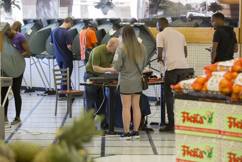 Voting inside a Fiesta grocery story in Houston on Tuesday Nov. 6, 2018.