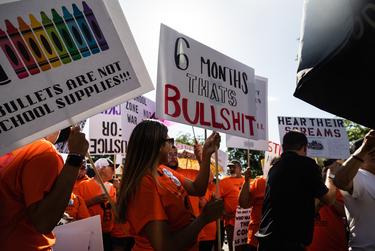 Family members and friends participate in a march in support of those killed and injured in the school shooting at Robb Elementary, in Uvalde on July 10, 2022.