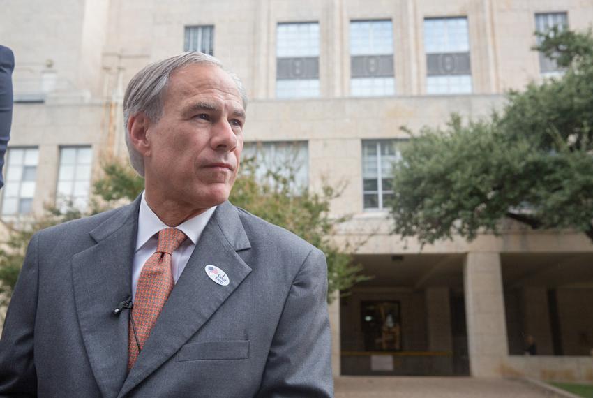 Gov. Greg Abbott speaks with reporters after voting early in the constitutional amendment election Wednesday at the Travis County Courthouse.