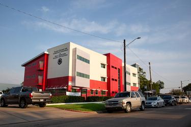 Vehicles line up to receive donations during the Drive-Thru Student School Supply Giveaway at Raul Yzaguirre School for Success in Houston, TX on Aug. 22, 2020.