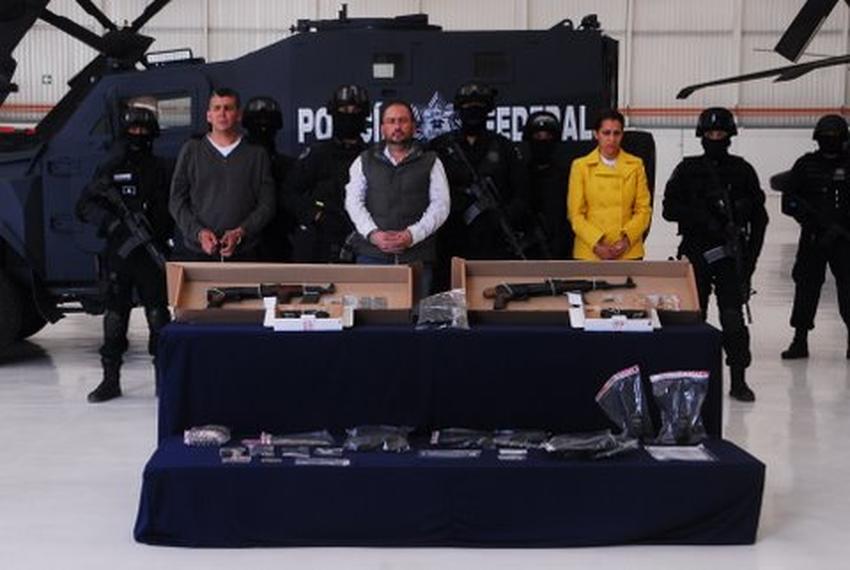 Alleged hit man Arturo Gallegos Castrellon, center, is displayed by Mexican law enforcement.