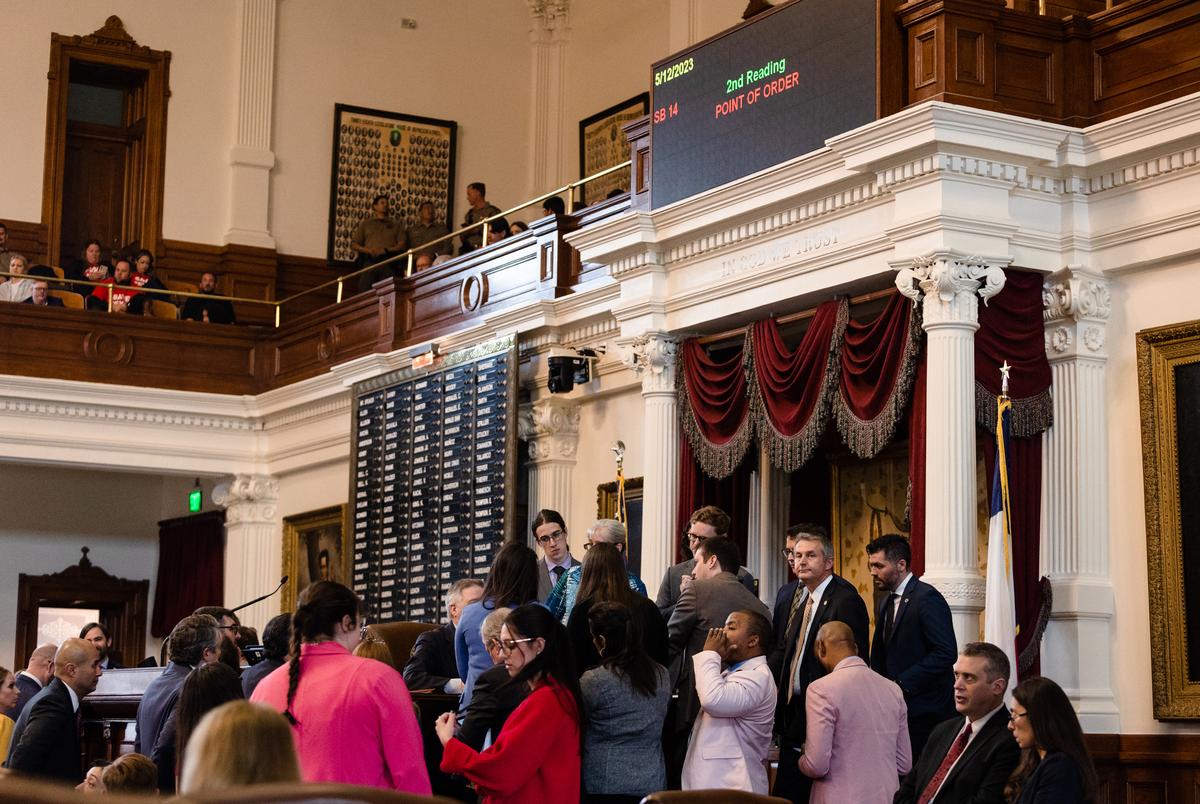 State representatives gather to listen to discussion of a Point of Order brought against SB 14, which seeks to ban puberty blockers and hormone therapies for transgender youth, on the House floor at the state Capitol in Austin on May 12, 2023.