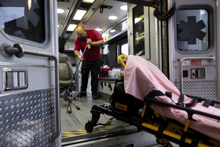 EMT in training Joe Bordner cleans out an ambulance after transporting a patient on Friday, Dec. 16, 2022.