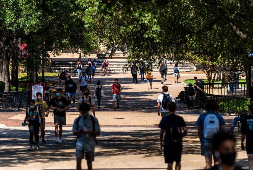 Students walk through an area known as “The Quad” on the first day of the fall semester at Texas State University in San Marcos on August 24, 2020.
