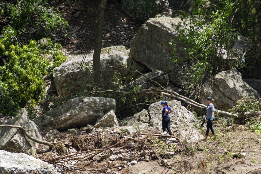 People work and clean around the Guadalupe River near the camp grounds of Camp Mystic on Wednsday July 9, 2025 in Hunt, Texas. 

(for editors, would it be better to describe them as volunteers? just curious)