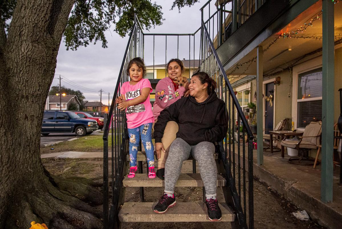 Elsa Ramirez, and her daughters Josseline, 11, and Francheska, 4, stand outside their home in Houston on Dec. 14, 2020. She and her three kids have managed to stay housed in her two-bedroom apartment, thanks to a federal eviction moratorium that expires at the end of the month.