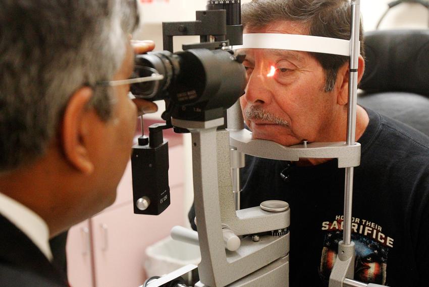 Dr. Alexander P. Sudarshan, an ophthalmologist, examined Jose Juan Herrera, a Vietnam War veteran, last month in Weslaco. Dr. Sudarshan treats patients referred by Veterans Affairs.