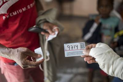 Reinaldo Ramirez Pacheco of Cuba shows his number of the waiting list to enter the U.S. in the rectory at El Buen Pastor migrant shelter on May 13, 2019. Ramirez has been at the shelter for two months.