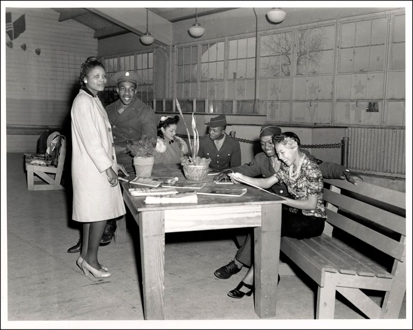 Troop Support: Interior view of the Negro War Recreation Council Building with 3 women and 3 Soldiers, January 6, 1944. (Photo courtesy of Austin History Center, Austin Public Library)