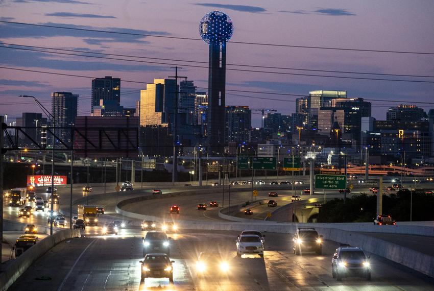 Cars drive on Intersate 35 East with the downtown Dallas skyline looming in the distance on Sunday, July 27, 2025.