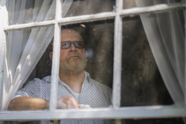 Tomas Garcia looks out of his home in Houston on Sept. 8, 2021.