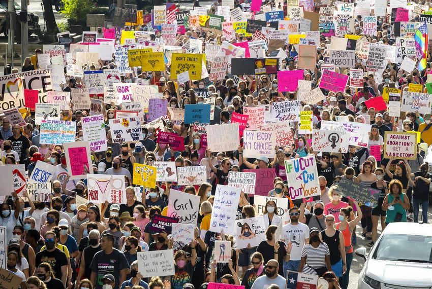 Thousands of participants march and with signs during the 2021 Women’s March on Texas in downtown Houston on Saturday, Oct. 2, 2021.