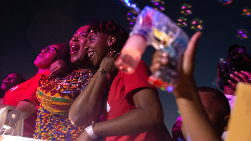 From left, Lisa Smith, Denise Weeks and Latarshia Hall react to Vivian Greenís performance during the "I Am Juneteenth" festival at the Panther Island Pavilion in Fort Worth on June 19, 2021.