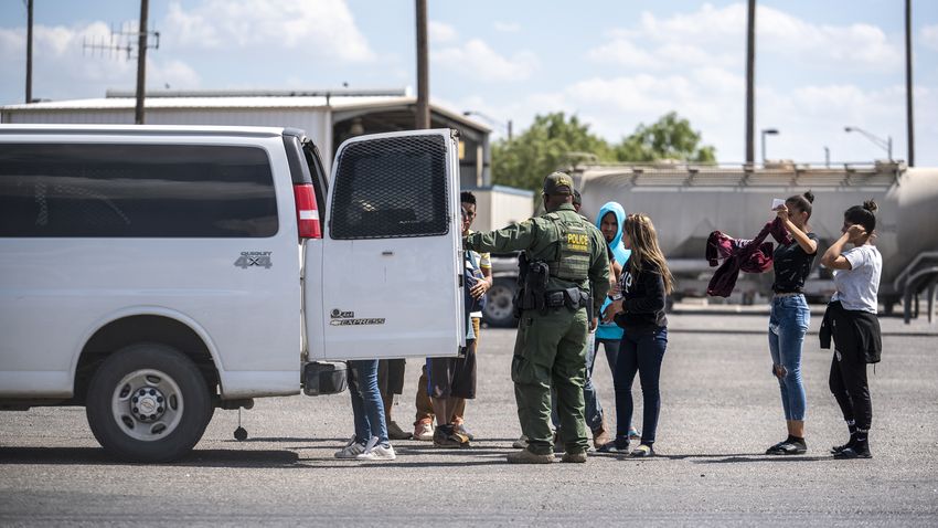 People who were apprehended by state troopers after crossing the border were brought to the International Bridge in Eagle Pa…