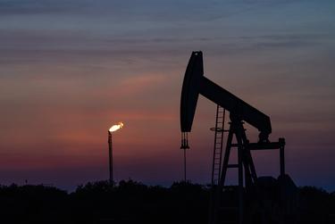 A pump jack and a gas flare in the Eagle Ford oil patch south of San Antonio.