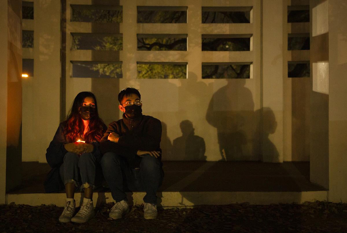 Anshu Shrestha and Jospeh Matawaran sat near the vigil held at the Grassy Knoll in Dallas. The group gathered to denounce racism againt the Asian community and the recent shootings in Atlanta. 