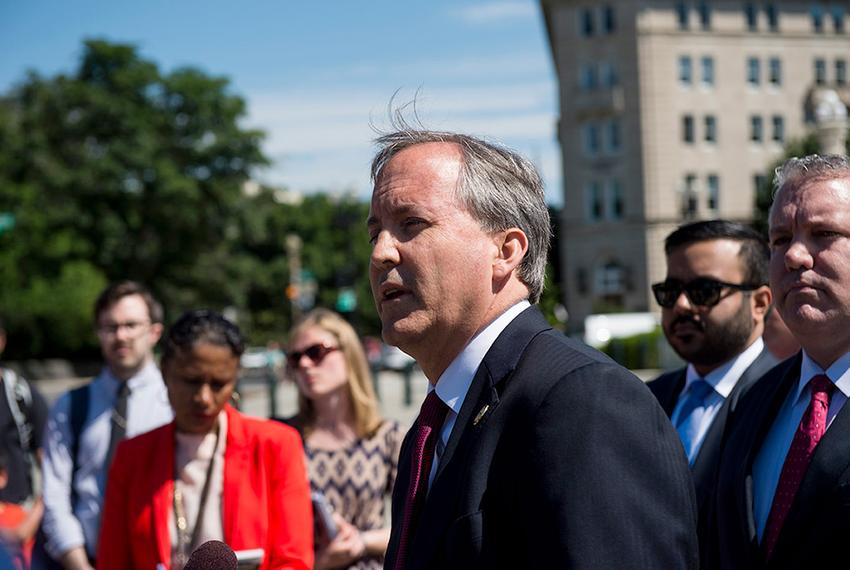 Texas Attorney General Ken Paxton holds a press conference on June 9, 2016 in front of the U.S. Supreme Court to discuss the filing of a lawsuit against the state of Delaware