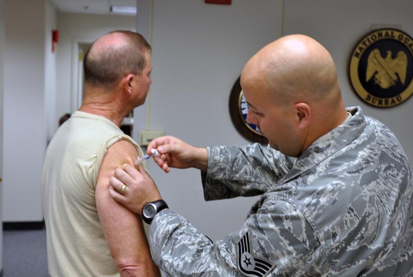 A National Guard soldier receives a seasonal flu shot in Virginia in 2009. 