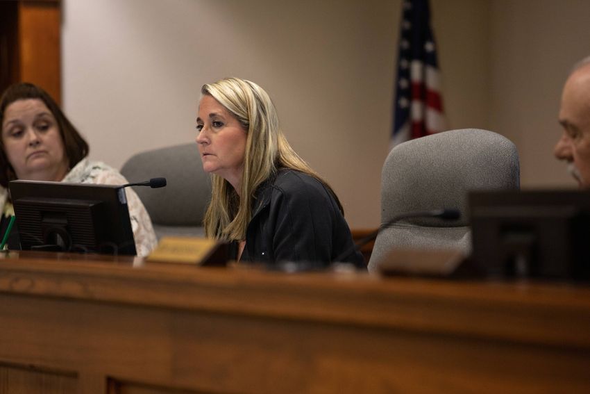 County Clerk Katie Lang listens motions for a two week suspension without pay after a vote allowed Election Administrator Mi…
