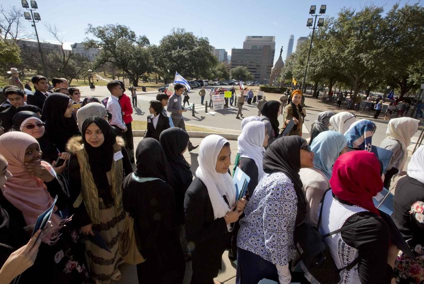 A group of school children look on at the Texas Muslim Capitol Day ceremony.