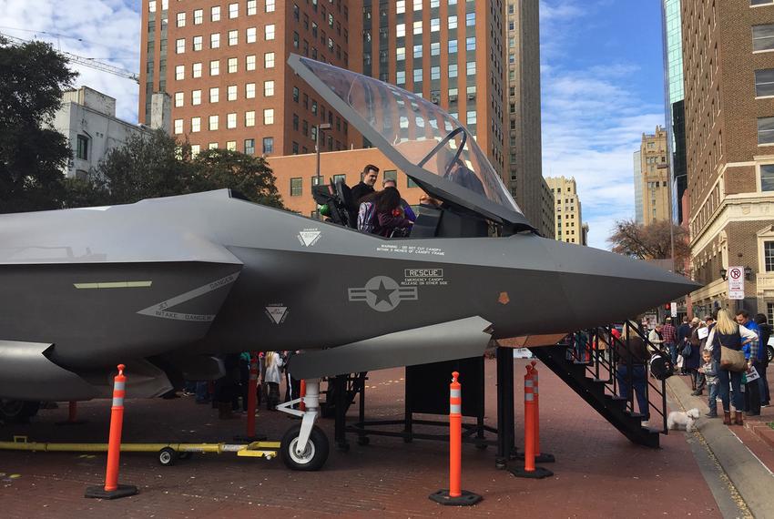 Fort Worth residents posed for photos on Dec. 21, 2016, with a model of the F-35 fighter plane, which is manufactured at a Lockheed Martin plant in the city.