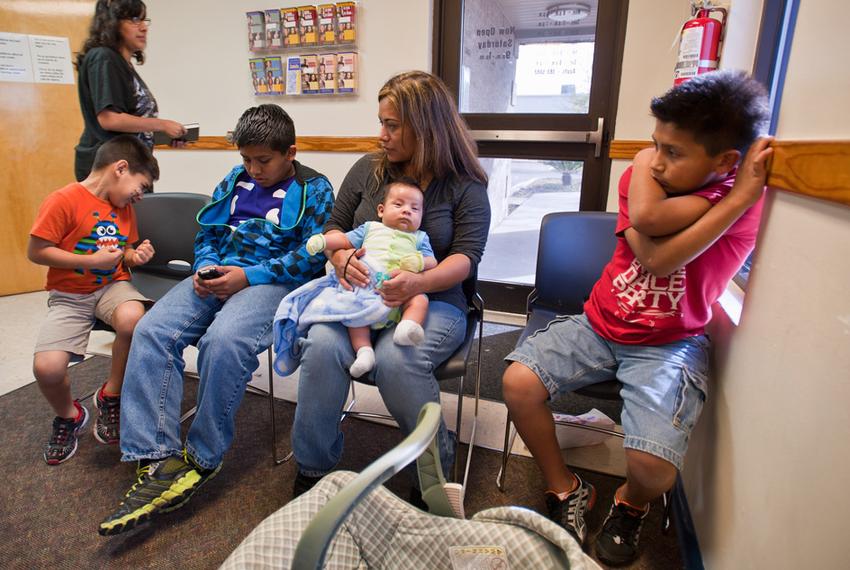 Rosario Espriella (center) waits for her appointment at the Edinburg, Texas Planned Parenthood clinic on Tuesday, February 14 with her children L to R:  Edgar, 6, Eduardo, 12, Diego, 2 months and Victor, 10.