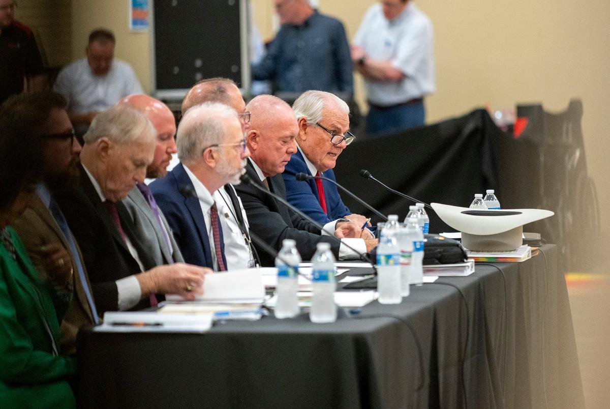 Kerr County Judge Rob Kelly (far right) answers questions during a joint committee hearing at the Hill Country Youth Event Center in Kerrville on Thursday, July 31, 2025.