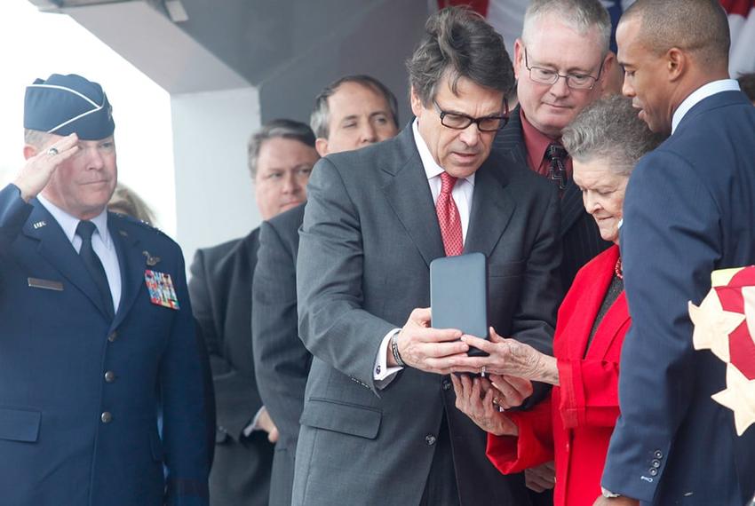 Governor Rick Perry and state representative Scott Turner, right, present Nadine Murphy, sister of the late Audie Murphy, with the posthumous Texas Legislative Medal of Honor for her brother in Farmersville on Tuesday, Oct. 29, 2013.