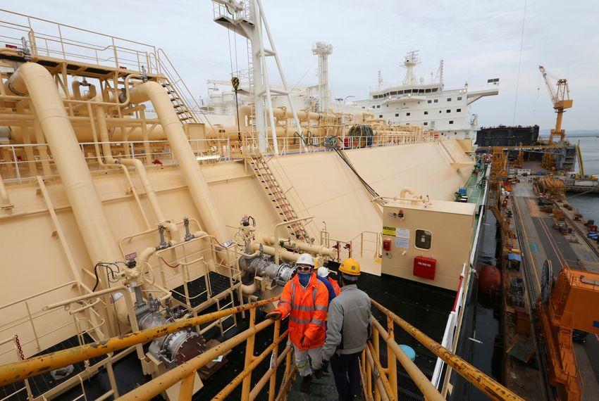 Workers board large-sized liquefied natural gas carriers under construction at the Daewoo Shipbuilding and Marine Engineering facility on Geoje Island, South Korea. The boom in fossil-fuel production in the United States has been matched by a rush on the other side of the Pacific to build the infrastructure needed to respond to the seemingly unquenchable thirst for energy among Asia’s top economies. Dec. 7, 2018.