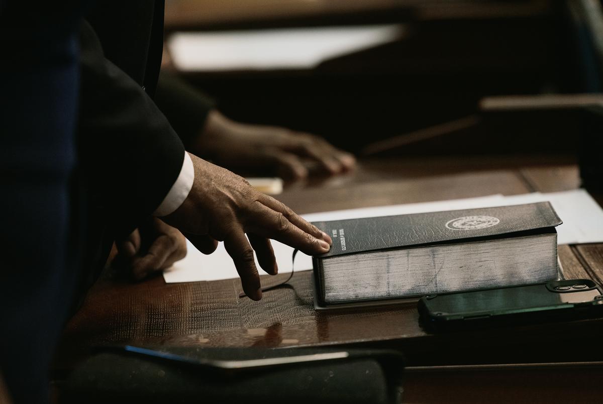 A christian bible sits on a representatives desk on the house floor on first day of the 88th legislature, Jan 10, 2023.